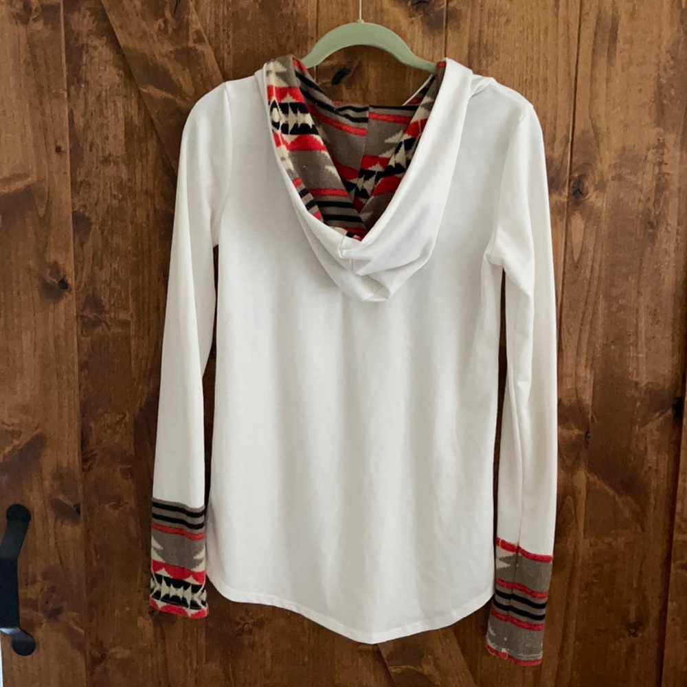 White long sleeve with winter printed sleeves and hood